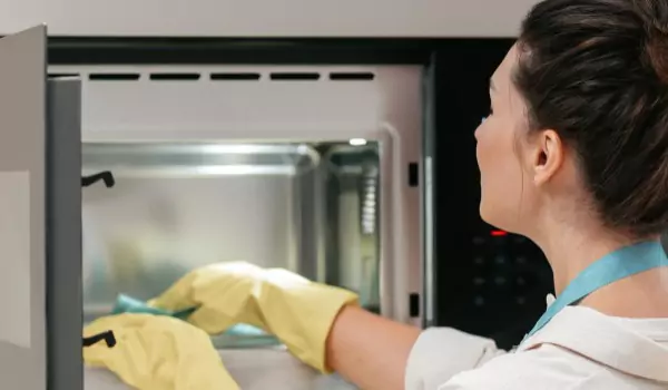 woman cleaning her oven