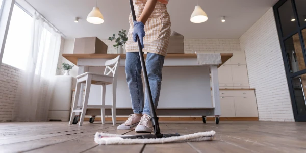 A lady mopping floor.