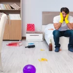 Man cleaning the house after party